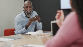 Social media interaction icons animation over business meeting in office. Networking, digital, communication, teamwork, collaboration, marketing - Powered by Shutterstock - Get 15% off with code: PIKWIZARD15