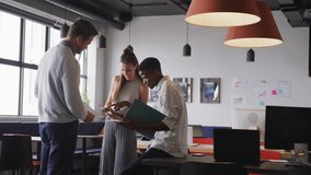 Social media notifications animation over diverse colleagues collaborating in modern office. Teamwork, collaboration, technology, coworkers, workplace, business - Powered by Shutterstock - Get 15% off with code: PIKWIZARD15