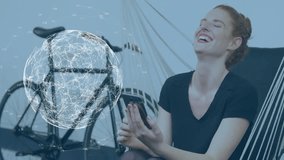 Digital network globe animation over woman using smartphone near bicycle. Technology, connectivity, global, communication, mobile, networking - Powered by Shutterstock - Get 15% off with code: PIKWIZARD15