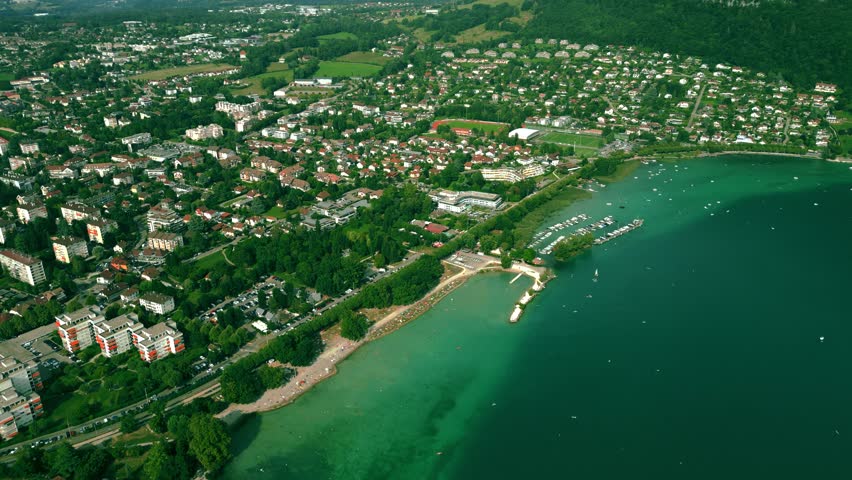 Aerial view of Annecy, the Plage d'Albigny lake beach and Annecy-le-Vieux residential area, France