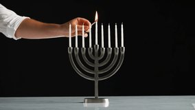 Lighting Hanukkah Candles Hanukkah celebration with Jewish holiday Hanukkah with menorah - Powered by Shutterstock - Get 15% off with code: PIKWIZARD15