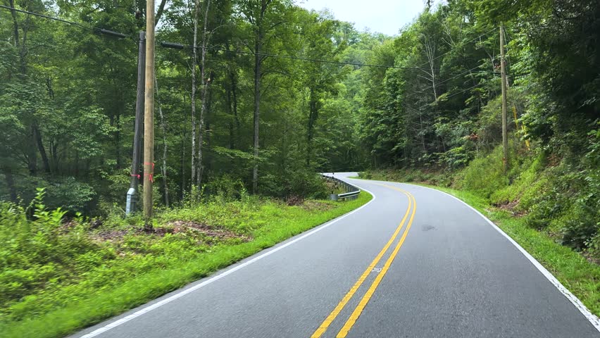 Driving through the woods at a in the Pisgah National Forest near Marion, North Carolina USA close to the Blue Ridge Parkway.