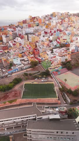 Aerial view of colorful buildings and a soccer pitch in the residential neighborhood, Barrio de San Jose, Las Palmas de Gran Canaria, Spain.