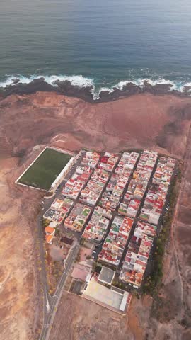 Aerial view of Las Coloradas Stadium surrounded by residential neighborhoods and the ocean, Las Palmas de Gran Canaria, Spain.