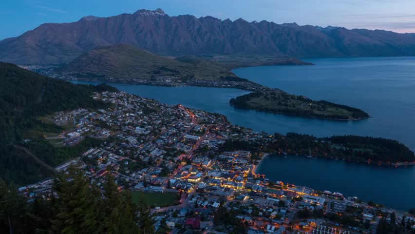 Time lapse looking down at Queenstown New Zealand at twilight.