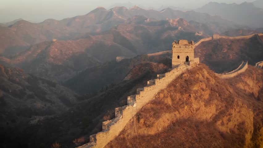 Aerial shot of the Great Wall of China at sunrise.