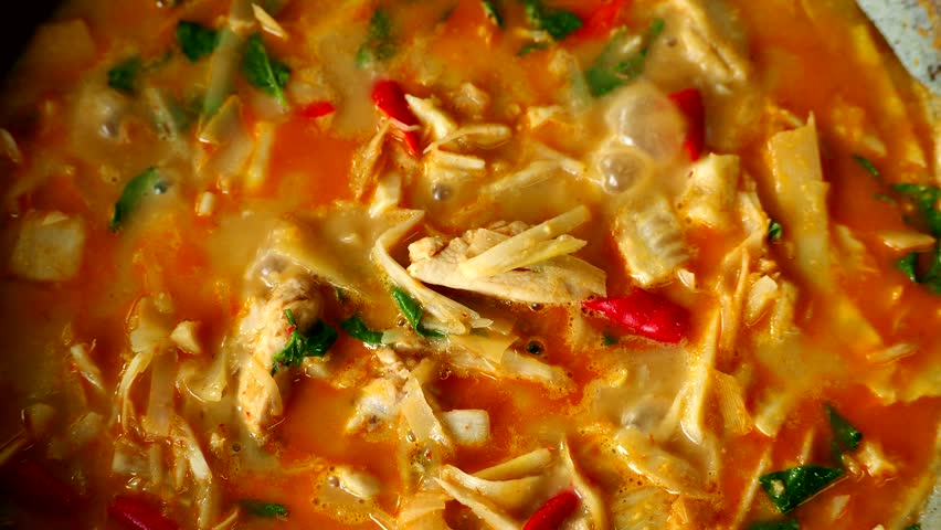 Cooking bamboo shoot curry in pan, in door  Chiangmai Thailand.