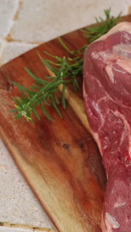 raw leg of lamb, close-up, on a cutting board