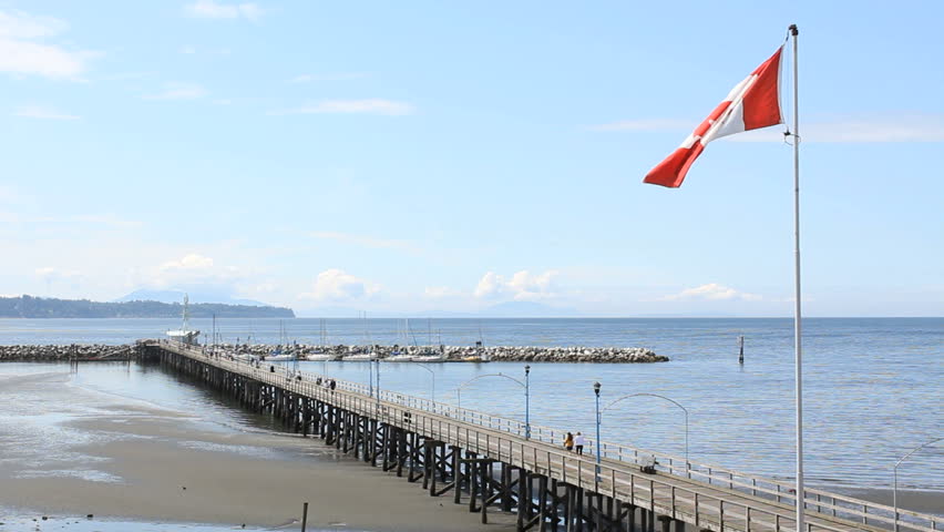 White Rock Pier and Beach, British Columbia. White Rock beach and the pier that leads out to it