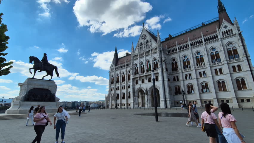 Budapest , Hungary - 06 14 2024: Hungarian parliament and Statue of Count Gyula Andrassy in Budapest