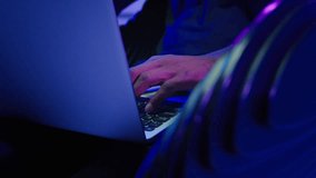 Hacker browsing studying computer futuristic cyberspace gamer African American man in headphones male guy typing laptop online internet security hacking play video game innovation futurism at chair - Powered by Shutterstock - Get 15% off with code: PIKWIZARD15