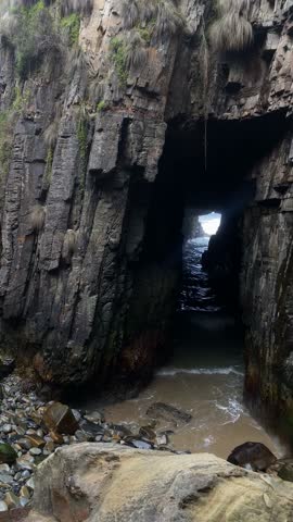 Waves crashing through sea cave