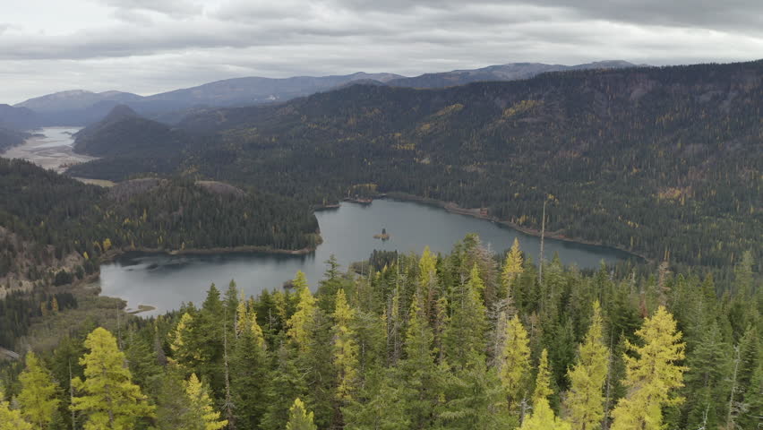 Scenic Lake, Larch Trees And Mountains In Washington State - Aerial Drone Shot