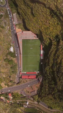 Aerial view of Estadio Silvestre Carrillo football stadium surrounded by scenic hills and urban landscape, Santa Cruz de La Palma, Spain.
