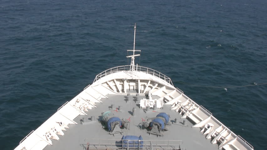 Top view of the bow of cruise liner, a cutting wave calm sea. Sunny