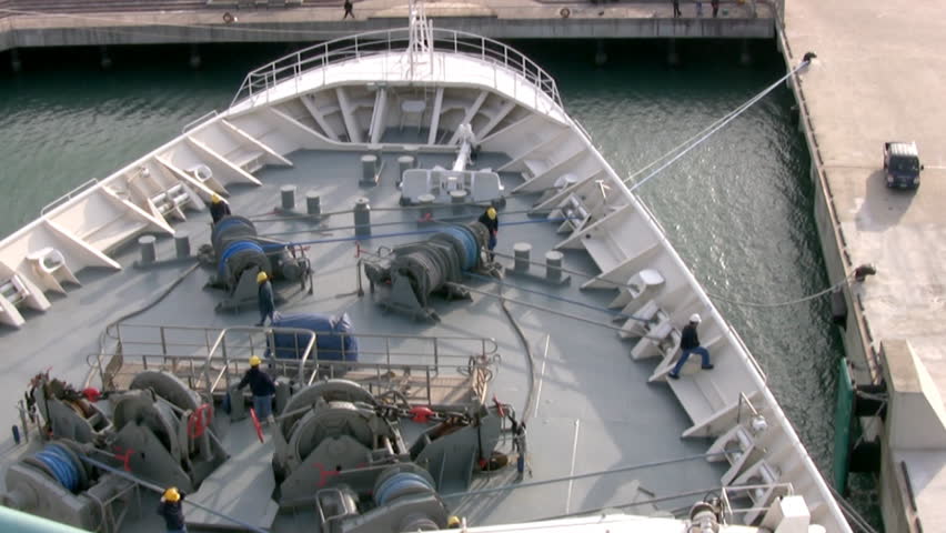 Deckhands removes the mooring at the bow of cruise ship. Timelapse