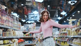A Joyful Woman is Happily Enjoying the Music while Shopping in the Busy Grocery Store Aisle,radiating positive energy and carefree vibes that light up her casual and colorful surroundings - Powered by Shutterstock - Get 15% off with code: PIKWIZARD15