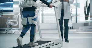 Woman Doing Physical Rehabilitation Using an Advanced Exosuit on a Treadmill in a Futuristic Medical Laboratory, Monitored by a Doctor. Advanced Technology and Research  - Powered by Shutterstock - Get 15% off with code: PIKWIZARD15
