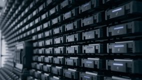 Rows of Blinking Black Drives Containing Training Data and Datasets for Supercomputers that Powering Massive AI Models. Advanced Storage Solution in Data Center. Cloud Computing and Processing Concept - Powered by Shutterstock - Get 15% off with code: PIKWIZARD15