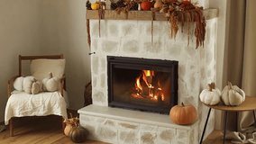 Stylish fireplace with pumpkins and autumn decor in modern farmhouse living room. Cozy autumn at fireside. Fall footage. Thanksgiving and Halloween - Powered by Shutterstock - Get 15% off with code: PIKWIZARD15