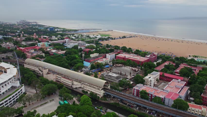 aerial view of marina beach and kamarajar promenade with government buildings, University of Madras, Ezhilagam, Napier Bridge, etc in chennai, tamil nadu, india. drone shot, 4k