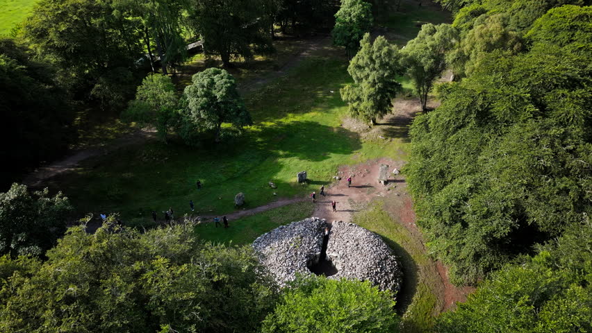 Aerial view of old burial cairns, each enclosed by stone circles, on a terrace above the River Nairn. Historical landmark Clava Cairns in Scotland.
