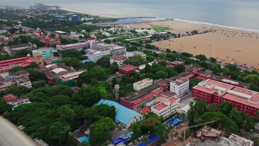 aerial view of marina beach and kamarajar promenade with government buildings, University of Madras, Ezhilagam, Napier Bridge, etc in chennai, tamil nadu, india. drone shot, 4k