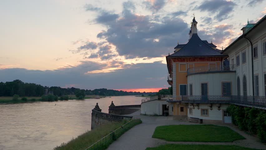 Beautiful sunset on  Elbe River. Baroque palace of Pillnitz. Dresden, Saxony, Germany