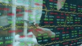 Animation of diagrams and stock market over caucasian businesswoman using smartphone in office. Technology, business and digital interface concept digitally generated video. - Powered by Shutterstock - Get 15% off with code: PIKWIZARD15