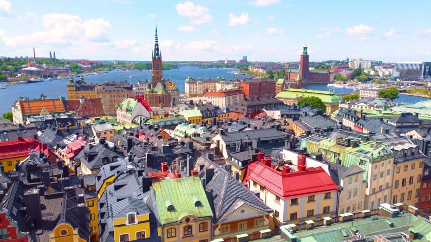 Stockholm city downtown with towers and colorful rooftops, aerial view