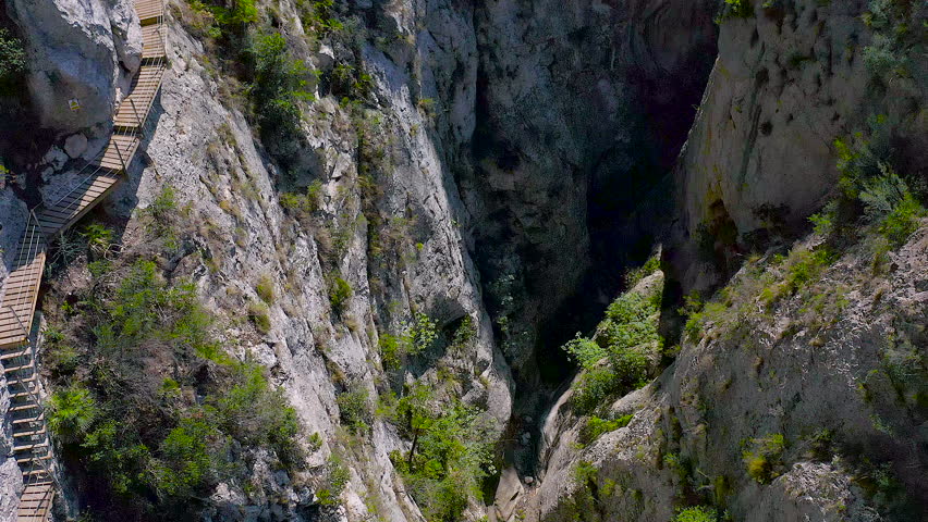 Drone view of the interior of the gorge in the town of Relleu, with its popular wooden walkway, anchored to the walls of the gorge, 80 metres from the bottom.
