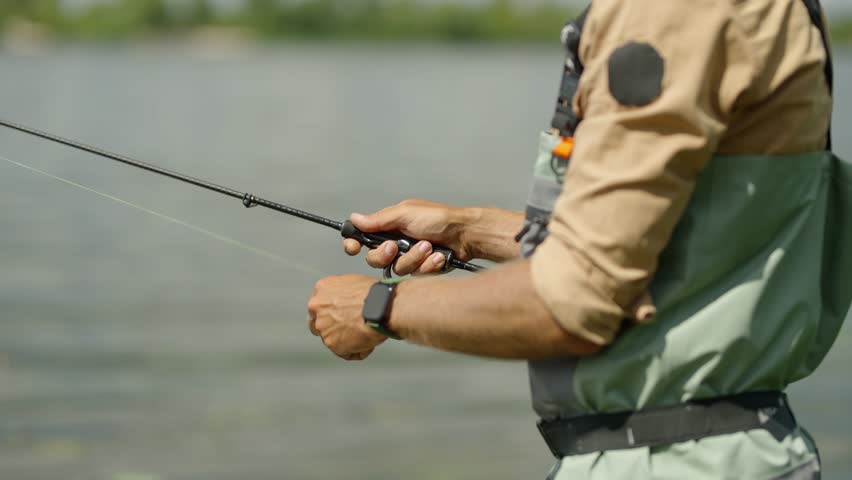 Angler Catching Fish Rod Trolling Lures. Fisher Pilling Perch. Angler Ultralight Catching Pike. Recreation Fisher. Fisherman Trophy Pilling On Braid. Happy Angler Catching Fish On Spinner Bait Minnow