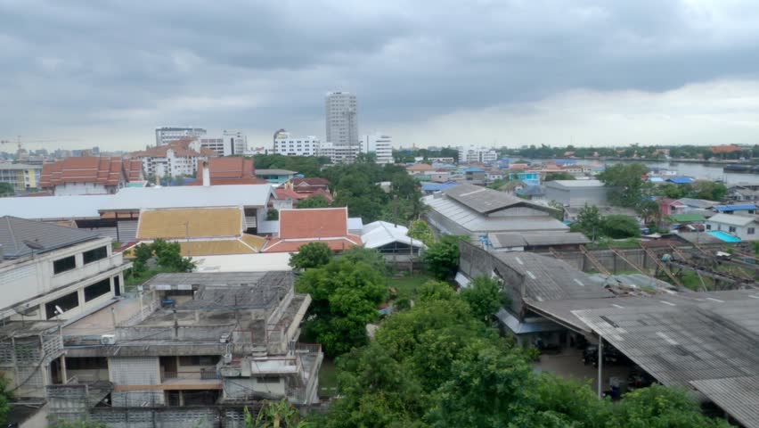 The city view out of the window of a moving train.