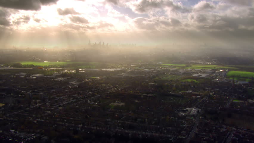 Panoramic and dramatic aerial view over the outskirts of London, England where the sprawling urban metropolis meets  the countryside.  Royalty-Free Stock Footage #3588389