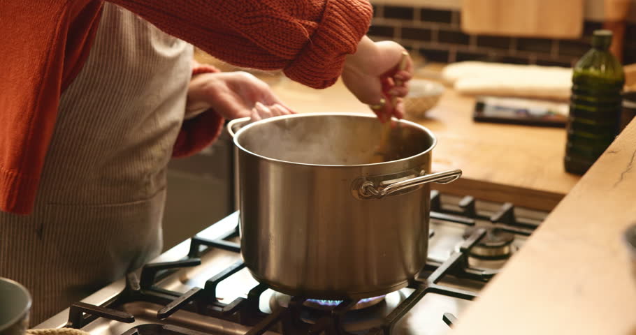 Cooking, stir and dinner with hands of person in kitchen for health, vegetables and food. Wellness, nutrition and diet with chef and ingredients in home for homemade meal, detox or organic pasta