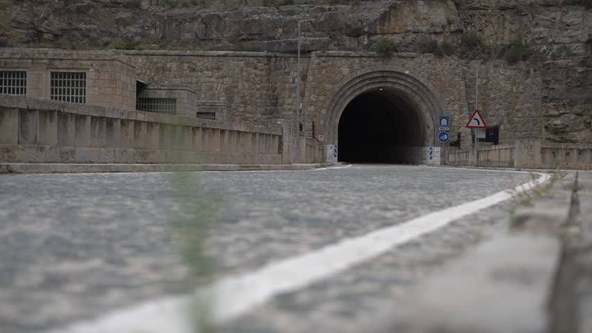 Classic motorcycle rider in a mountain road