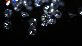 Diamonds rotating on black background, crystals, beautiful shining brilliants sparkling with colorful caustics, rainbow lights. Moissanite. Zirconia. Diamonds sparkle and shimmer on black  - Powered by Shutterstock - Get 15% off with code: PIKWIZARD15