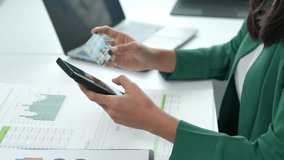 Businesswoman is paying online using her smartphone and credit card - Powered by Shutterstock - Get 15% off with code: PIKWIZARD15