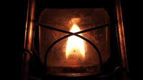 A detailed close-up loop of a kerosene lantern with a flickering flame within the glass enclosure. - Powered by Shutterstock - Get 15% off with code: PIKWIZARD15