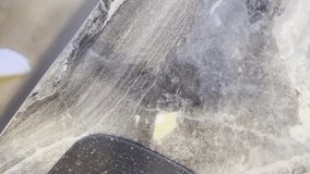 A grey stone counter top with a black object on it. The counter top is very textured and has a lot of detail - Powered by Shutterstock - Get 15% off with code: PIKWIZARD15