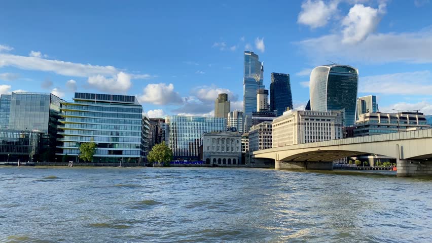London Bridge to the modern skyscrapers of the City Financial District across the River Thames.