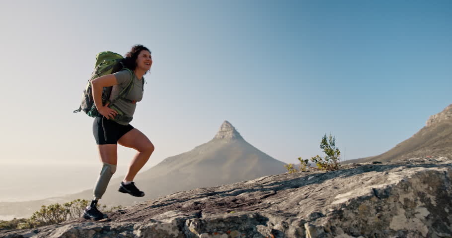 Woman, success and prosthetic leg for hiking on mountain for exercise, workout and fitness. Achievement, training and person with a disability outdoor for adventure, celebration and rehabilitation