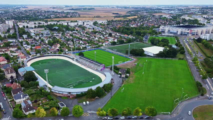 Receding aerial movement from the Venois Stadium and Malherbe Stadium, Caen, France.