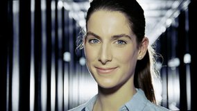 Portrait of a female IT engineer who is working in a data center with rows of server racks and computers.  - Powered by Shutterstock - Get 15% off with code: PIKWIZARD15