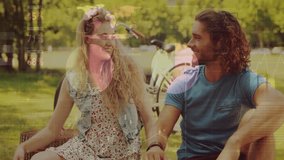 Animation of financial data processing over caucasian couple having picnic in park. Global finances, lifestyle, computing and digital interface concept digitally generated video. - Powered by Shutterstock - Get 15% off with code: PIKWIZARD15