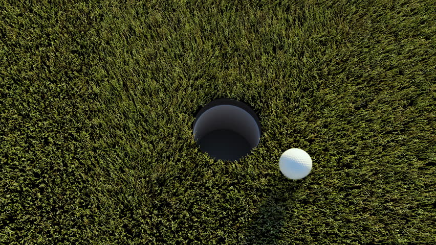 failure missing the target,camera follows ball on golf course that misses the hole,unsuccessful unluck concept