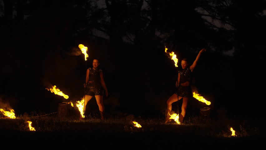 Professional Female Dancers Dancing And Performing Tricks With Fire, Amazing Fire Show In Nature