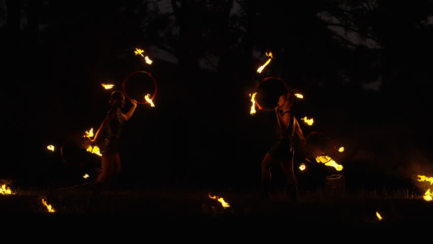 Fascinating Fire Show, Professional Circus Performers Performing Tricks With Fire And Dancing