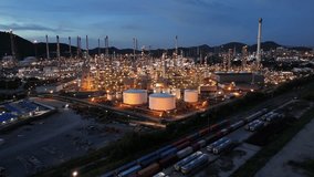 Oil Refinery plant at sunset. Gas Chemical Equipment Prodiction import export Concept, Crude Oil Refinery Plant Steel Pump Pipe line and Chimney and Cooling tower, Chemical Petrochemical - Powered by Shutterstock - Get 15% off with code: PIKWIZARD15