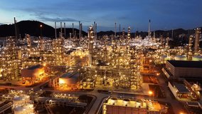 Oil Refinery plant at sunset. Gas Chemical Equipment Prodiction import export Concept, Crude Oil Refinery Plant Steel Pump Pipe line and Chimney and Cooling tower, Chemical Petrochemical - Powered by Shutterstock - Get 15% off with code: PIKWIZARD15